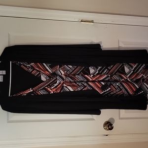 Dress with built-in jacket. Dress is v-neck black white orange worn once